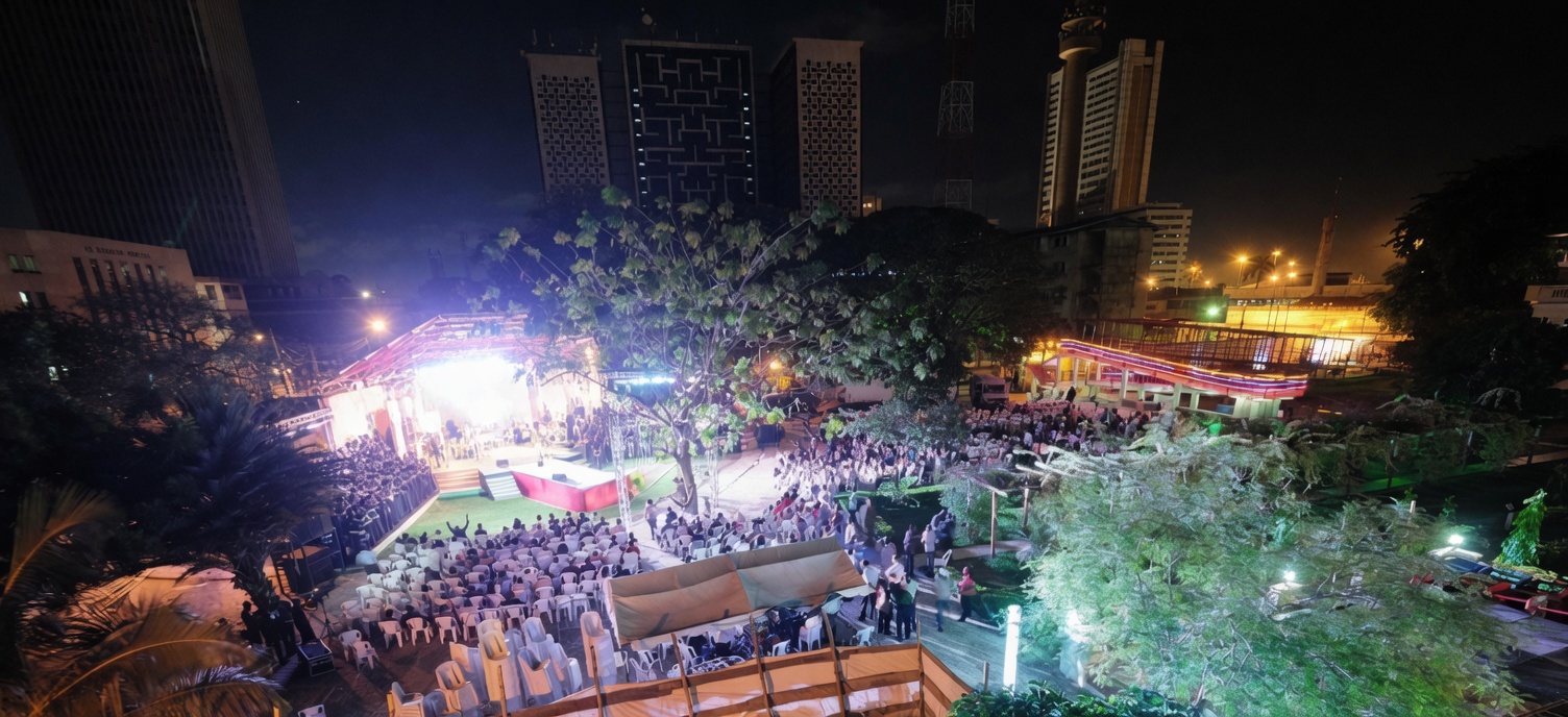 Aerial view of Awesome Praise 5 at Freedom Park Lagos, 11 November 2011 — the lit stage, packed audience, and Lagos skyline at night